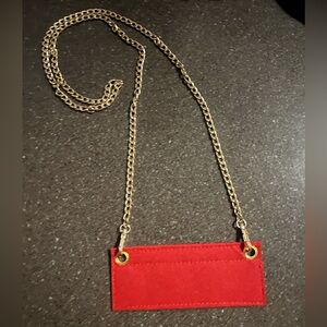 51” Gold Color Chain and approximately 6-3/4” X 3” Red Insert. New